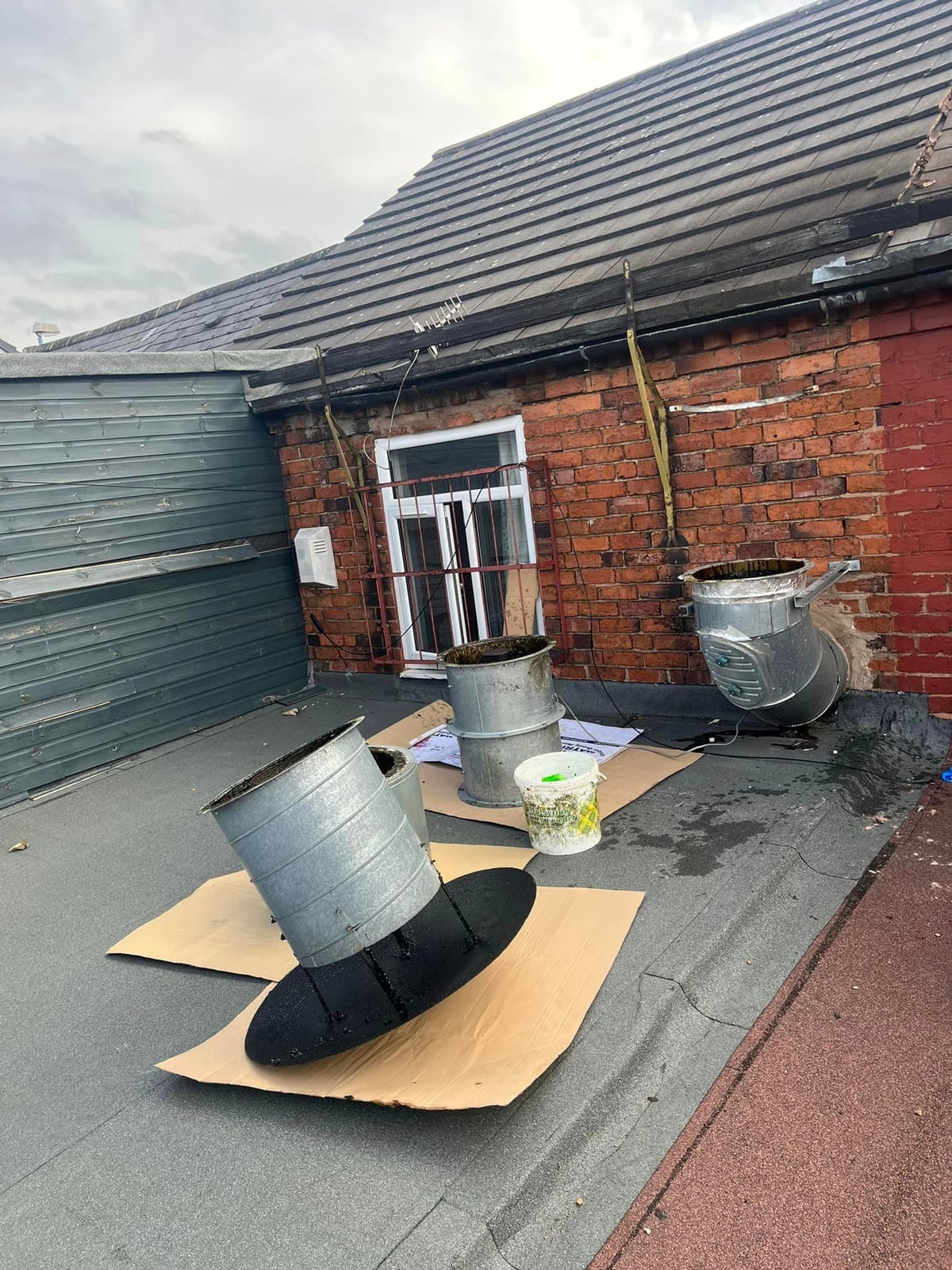 CS Cleaning & Ducting Specialists technician working on commercial ducting from scaffold